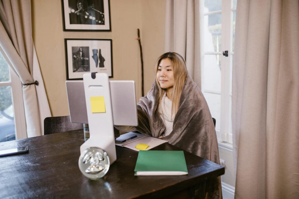 woman in brown robe sitting on chair